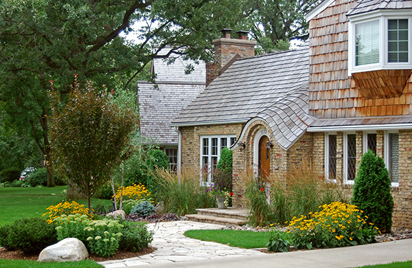 Edina Minnesota Cap-Cod home with Concrete driveway with flagstone walkway