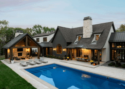 Custom pool and stone patio with lighting in Orono Minnesota