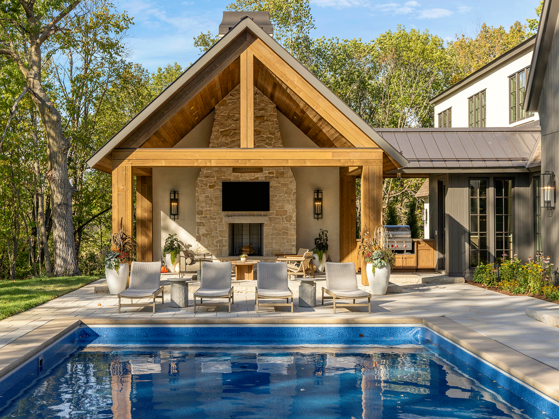After of Covered Stone Paver Lounge Area with Fireplace