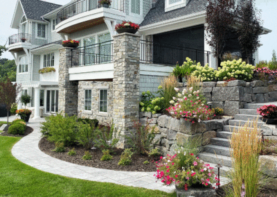Colorful Backyard Paver Walkway and Dry-Stacked Granite Stone Wall