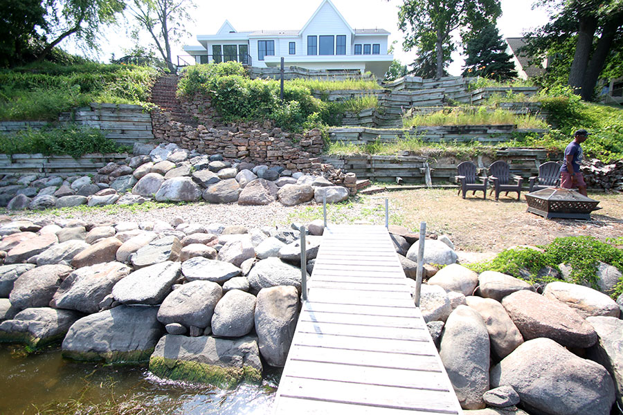 Before Photo of Deteriorating Retaining Walls and Shoreline for New Construction Home on Lake Minnetonka MN