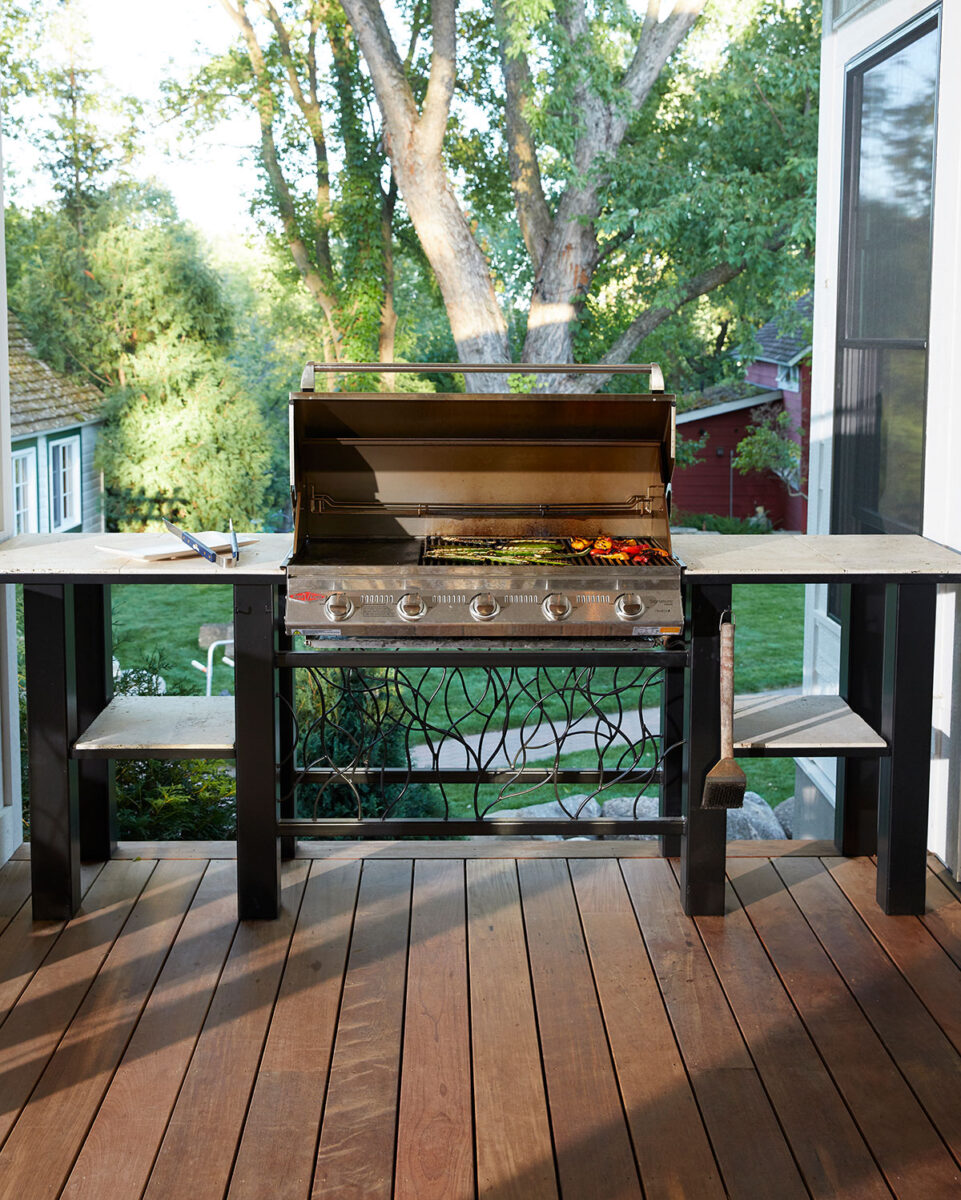 Custom-Outdoor-Kitchen-with-Metal-and-Stone-Grill-Stand-on-Raised-Wood-Deck-in-Minnesota
