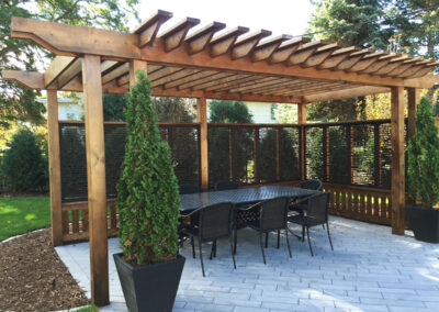 Custom Arbor with Privacy Screens on Landscaped Patio