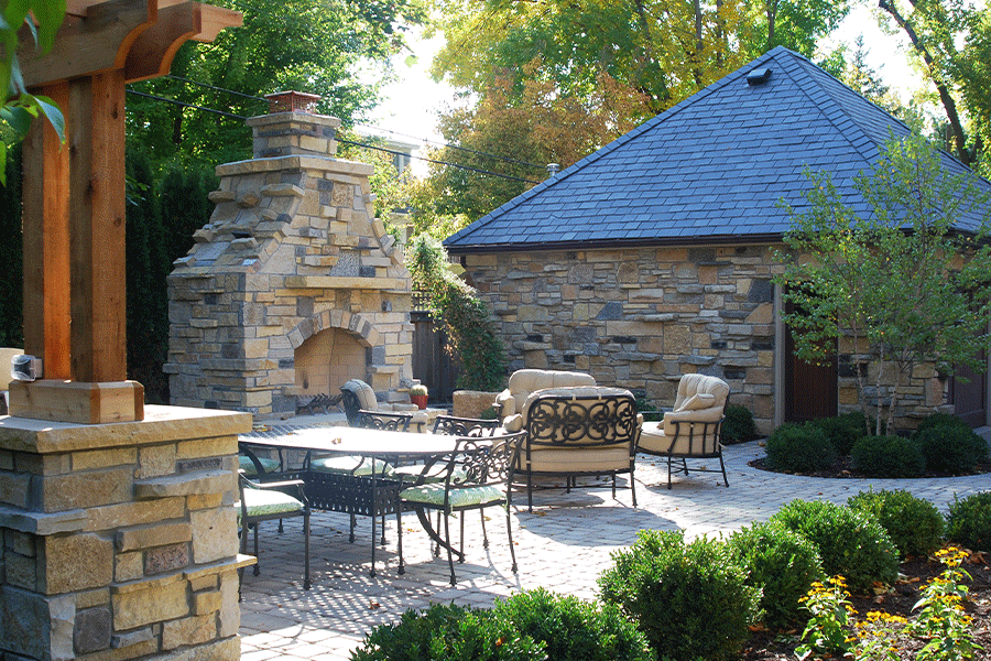 Edina MN Entertainers backyard with outdoor kitchen and Fireplace