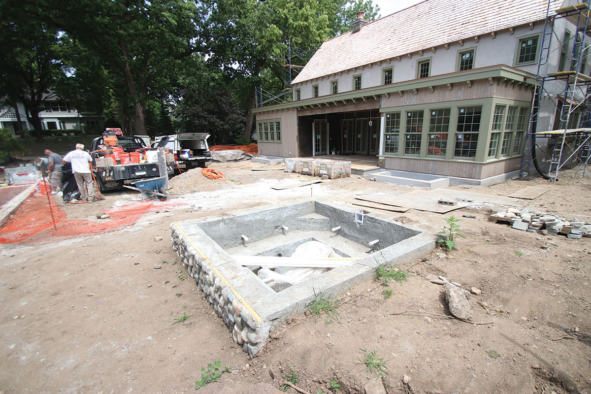 Photo of spa construction and backyard area before sod, walkways, and patios.
