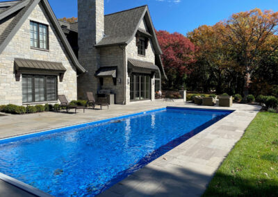 Finished vinyl modern pool with bluestone patio near Mendota Heights