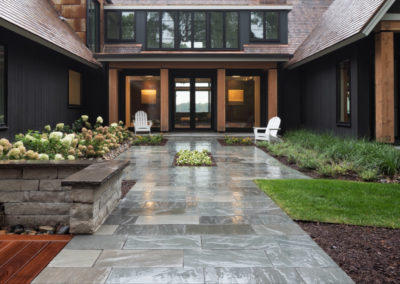 Modern New Build Front Entry with Elements of Bluestone, Limestone, and Wood