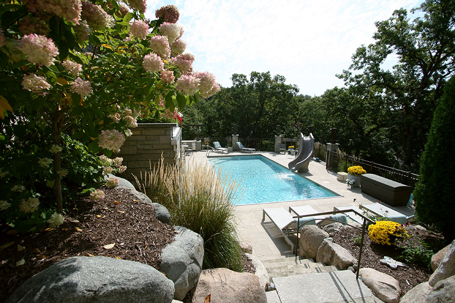 Edina, MN Newly Raised Terrace with Concrete Pool, Stone Patio, and Custom Fencing