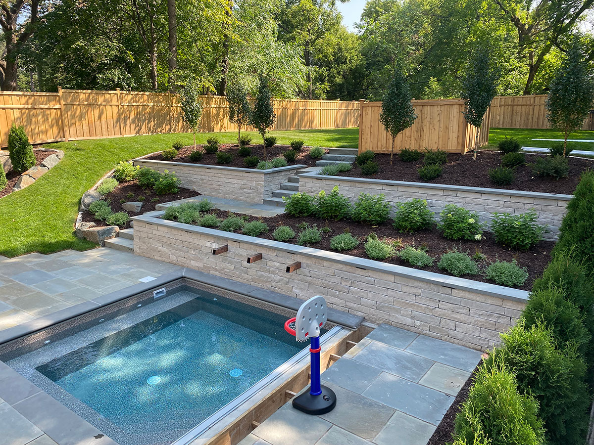 Minneapolis Minnesota Backyard with custom vinyl dipping pool with auto cover for year-round enjoyment