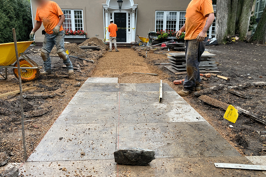 Installing new limestone pathway to front entry