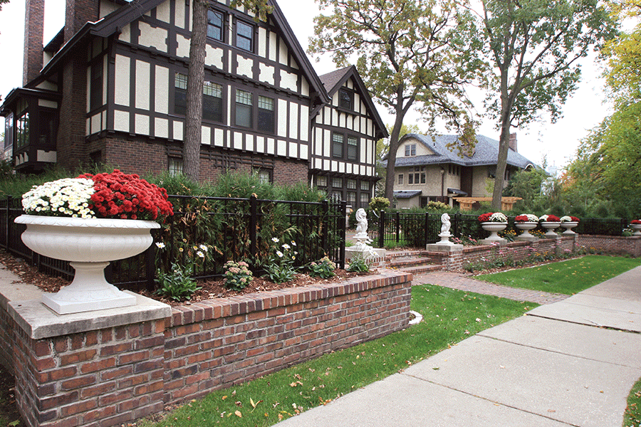 Historic Minneapolis Front Renovation with Plantings and Urns
