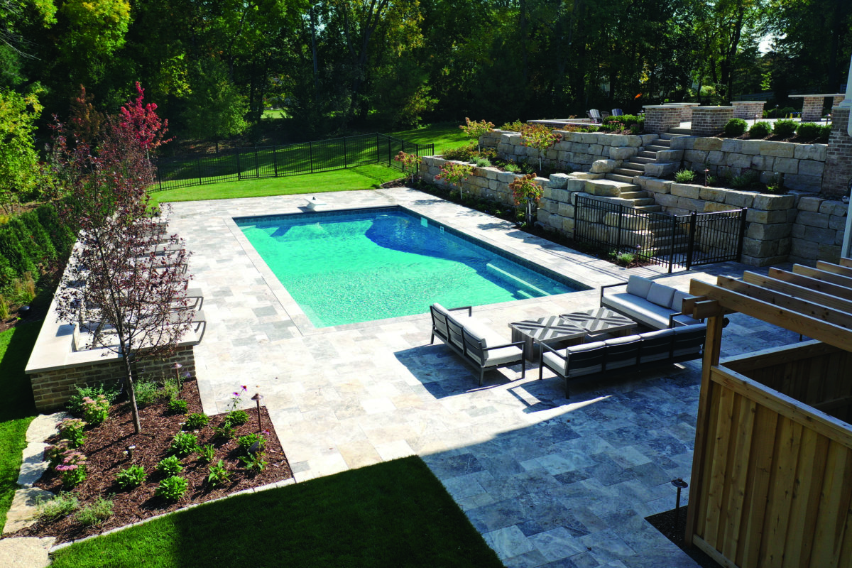 concrete pool installation and limestone patio in edina mn