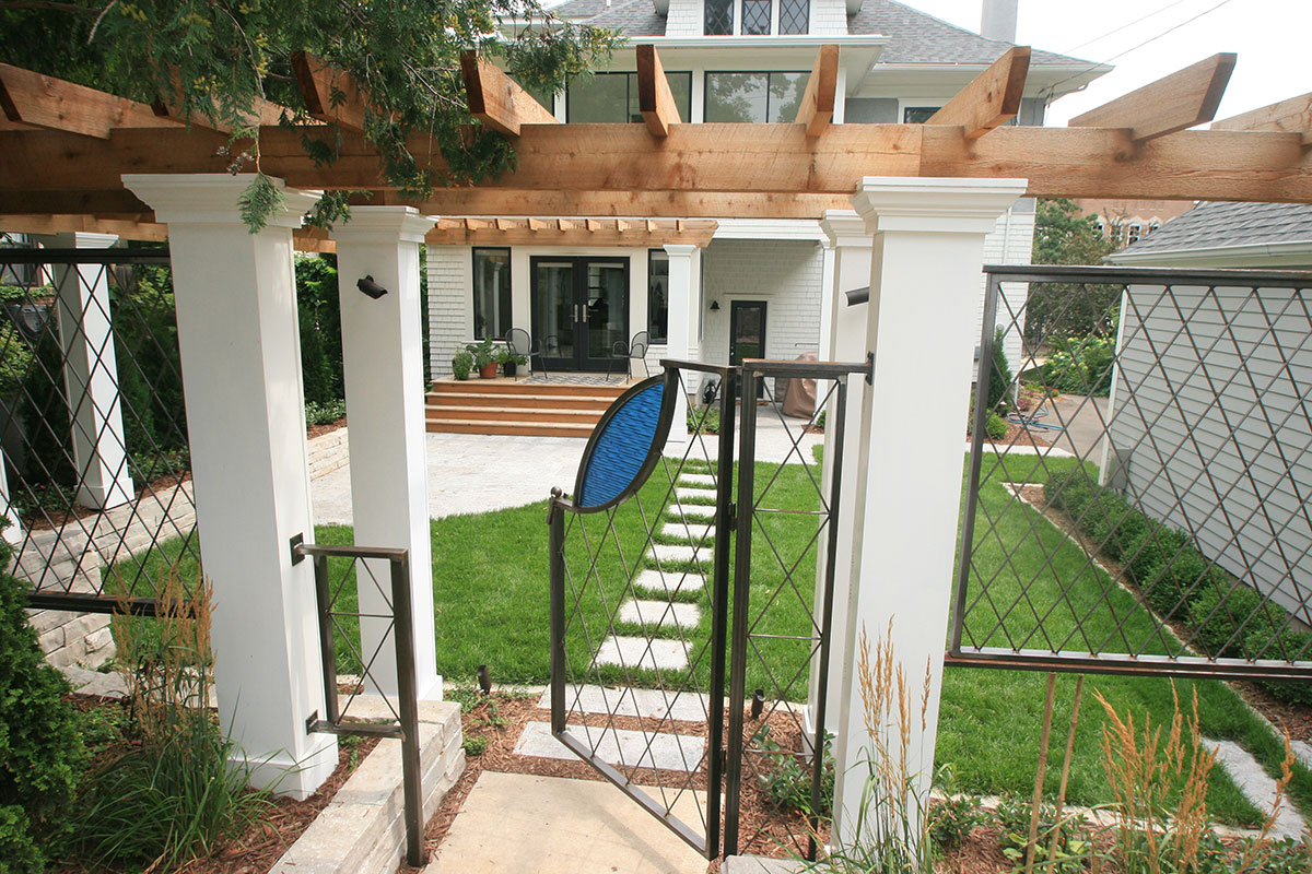 Minneapolis-MN-home-with-custom-gate-and-fencing-attached-to-a-cedar-arbor-for-security-and-interest