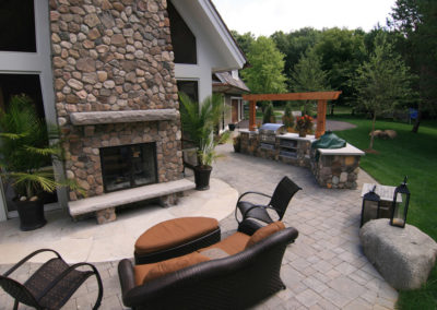 Outdoor Kitchen and River Rock Fireplace in Orono, MN