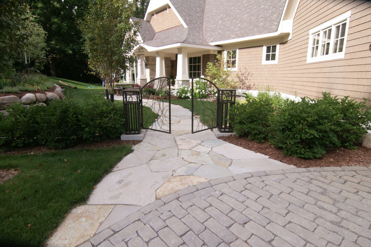 Wayzata Minnesota home with shrubs and custom metal gate for privacy and screenage