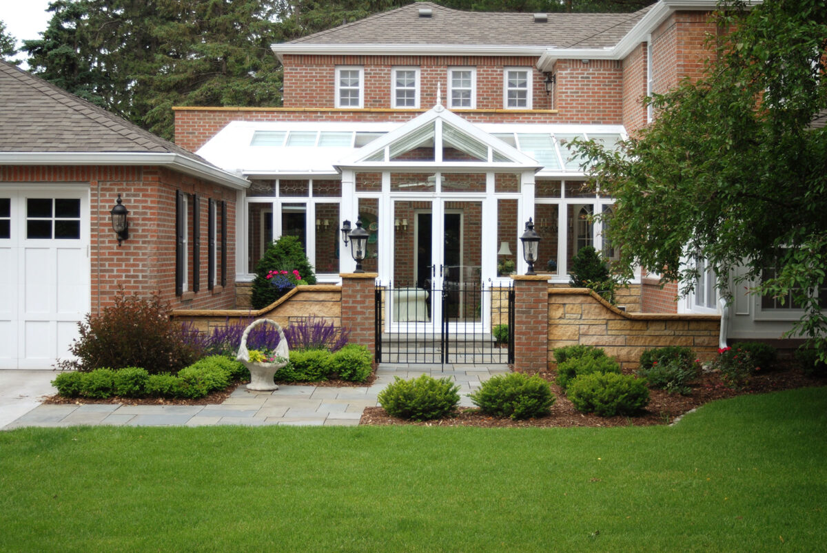 Small Stone Wall and Metal Gate at the Front Entrance of the Edina Minnesota Home to Create a Courtyard