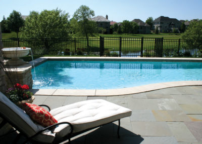 Custom Concrete Pool with Water Features Overlooking Golf Course