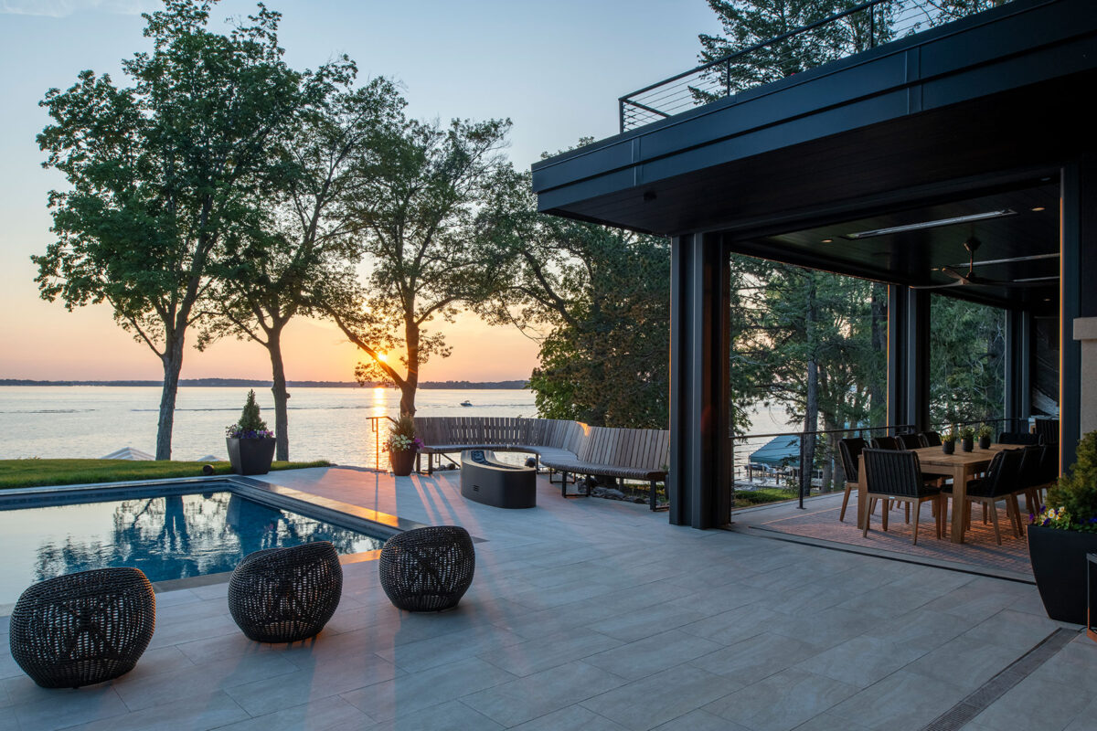 Custom Curved Bench and Metal Fire Feature Along Pool and Patio in Minnesota