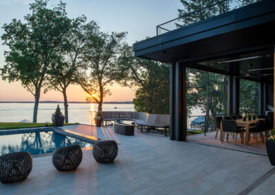 Custom Curved Bench and Metal Fire Feature Along Pool and Patio in Minnesota