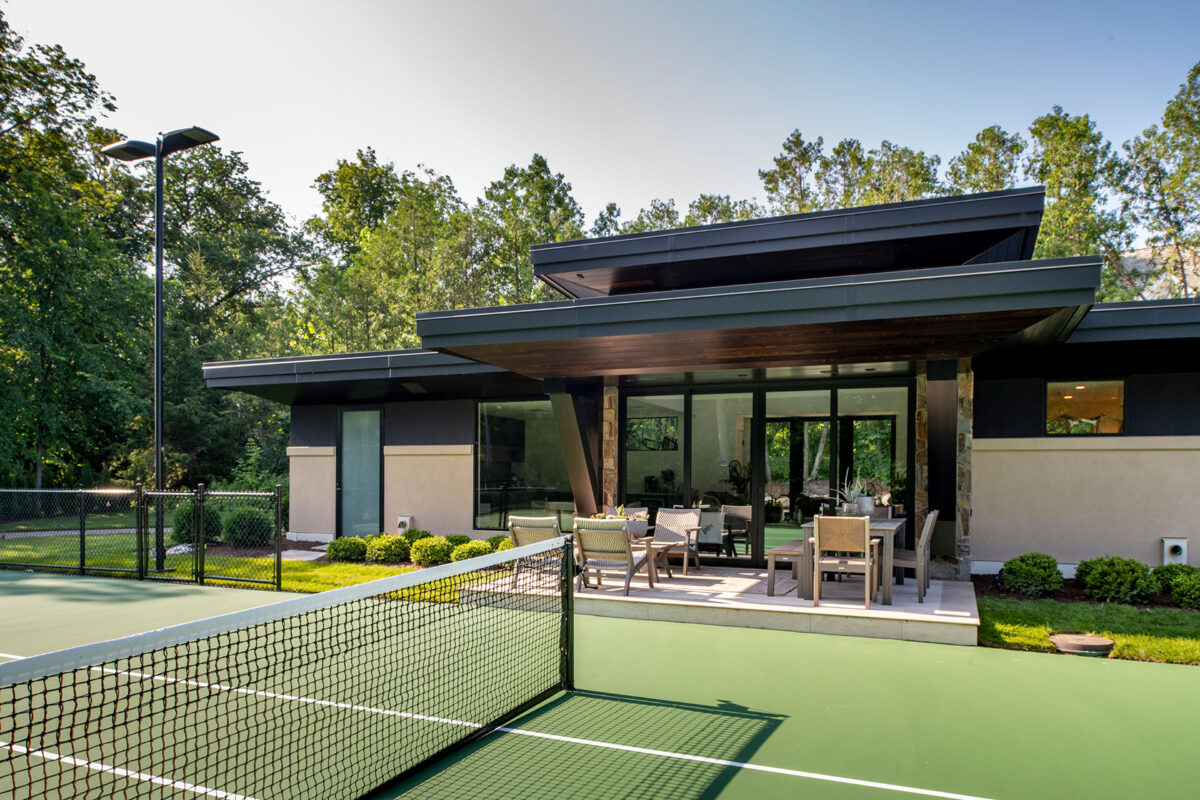 Clubhouse and Tennis Court at Entrance of Modern Luxury Home on Lake Minnetonka, MN