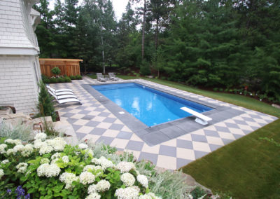 Wayzata Vinyl Pool with Checker-Board Concrete Patio Surround