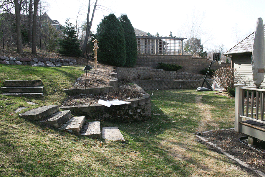 Wood-deck-with-river-rock-wall-before