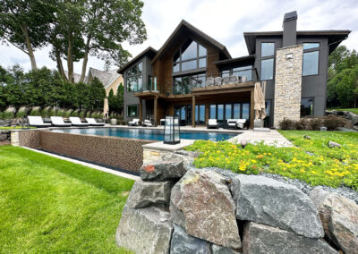 Vanishing Edge Swimming pool and stone patio in Victoria Minnesota