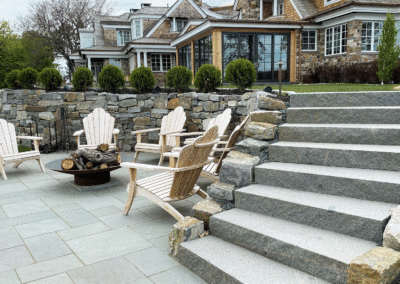 Granite Dry-Stacked Wall Surrounds Bluestone Patio and Granite Stairs to the Lake